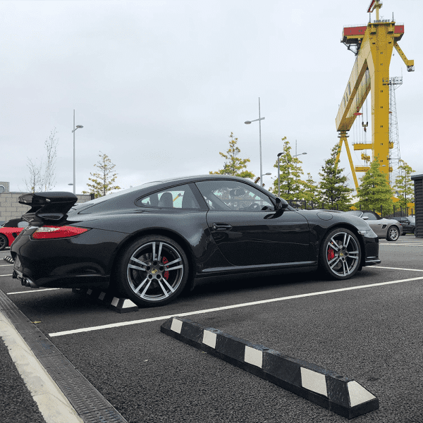 Moulded rubber vehicle stops by Emtek for workplace safety protecting kerbs and vehicles